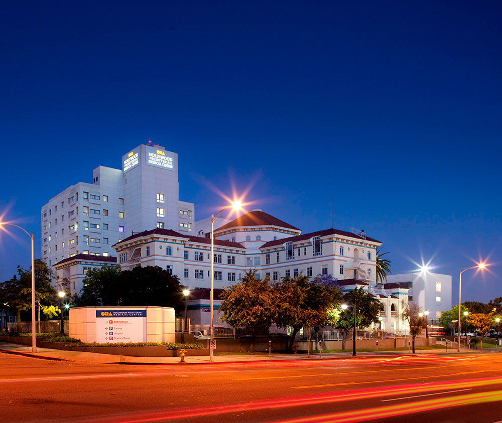 Beautiful photo of the hospital buildings and corner from across the street at sunset