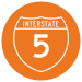 Circle icon, white text is Interstate 5, against orange background