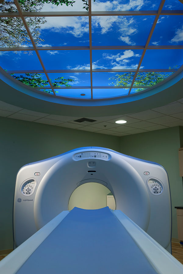 Looking into MRI machine in an attractive, light MRI suite